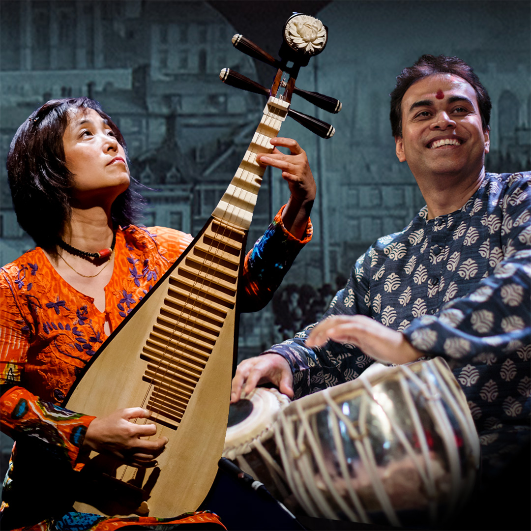 Wu Man, seated, plays the pipa, a four-stringed lute-like instrument. Sandeep Das, seated, plays the Tabla, an Indian hand drum.